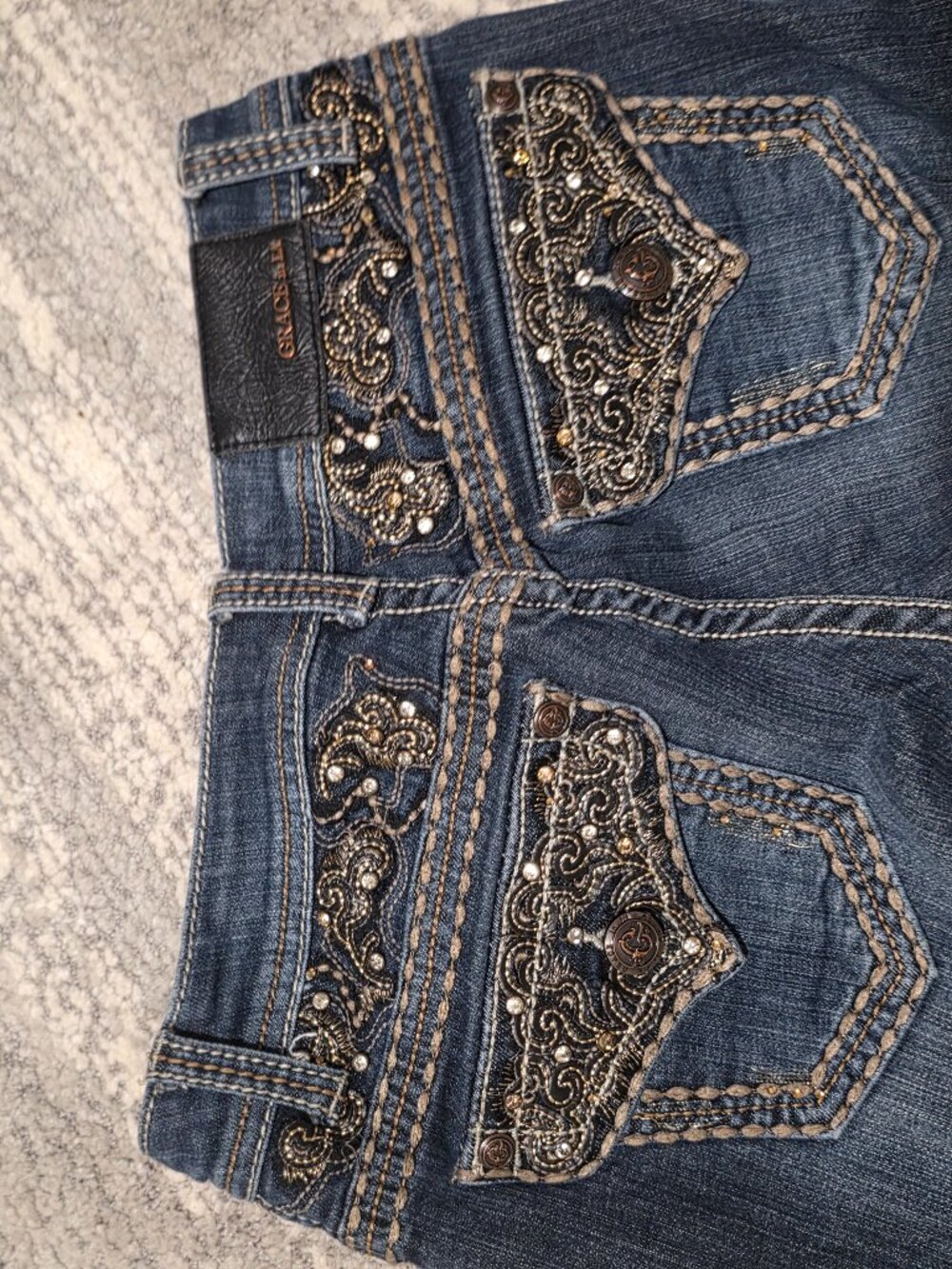 Bootcut 2000s jeans, embroidery.